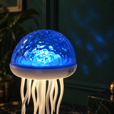 Lampe Médusa effet lumineux blanc chaud sur table de nuit