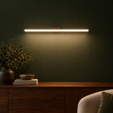 Applique Luna horizontale lumière blanche au-dessus d'un lit – ambiance chambre moderne